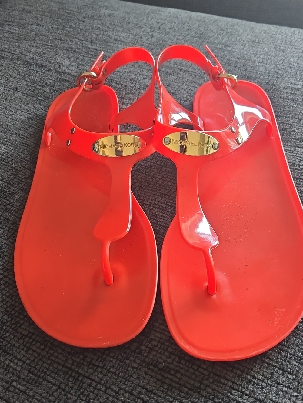 Michael Kors Bright Orange Jelly T-Strap Sandals with Gold Plaque